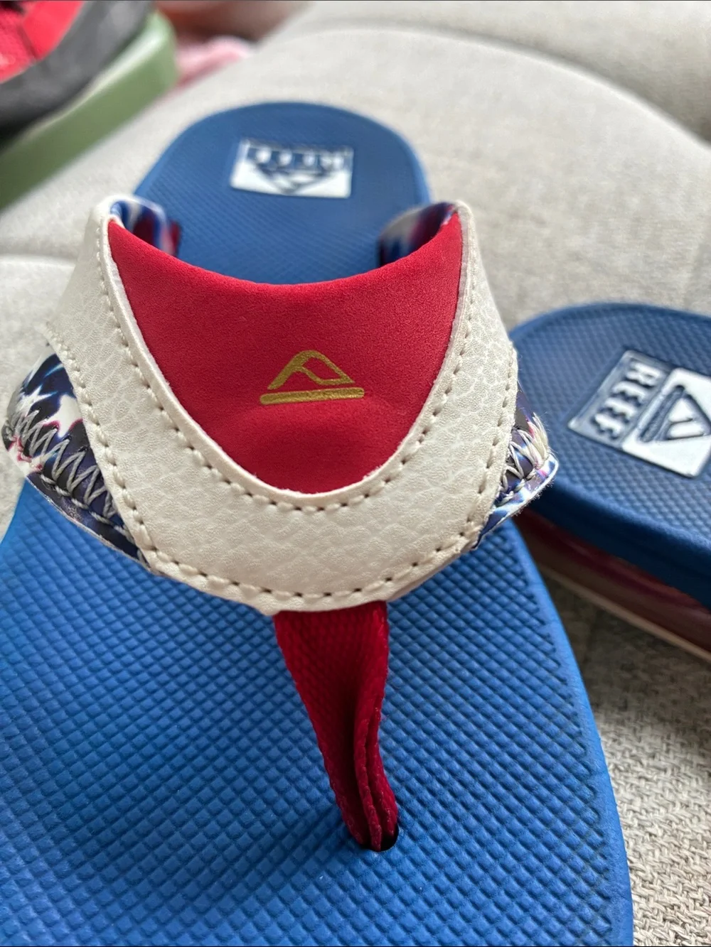 Reef Blue Navy Flip Flops with Red and White Accents